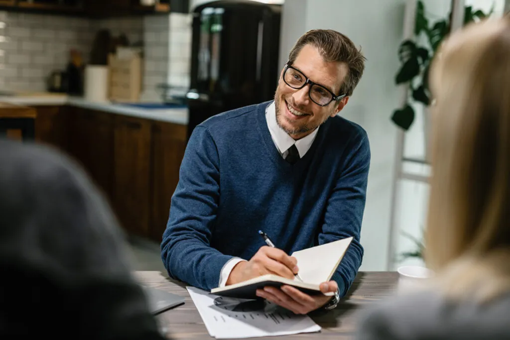 Career advisor taking notes during a consultation